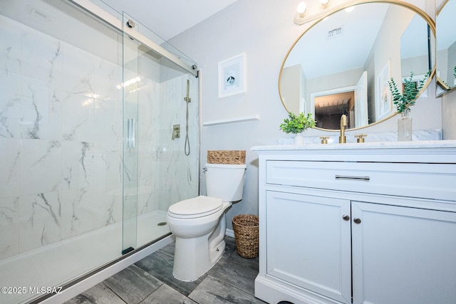 2943 N Gold Creek Pl, Tucson, AZ 85745 - full bathroom featuring a marble finish shower, toilet, and vanity