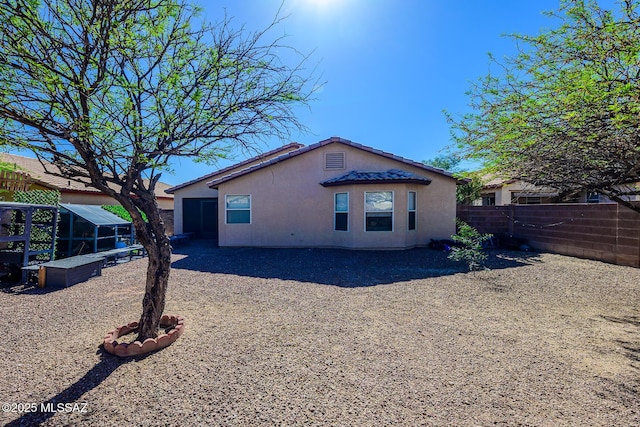 2943 N Gold Creek Pl, Tucson, AZ 85745 - back of property featuring a fenced backyard and stucco siding
