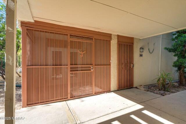 1600 N Wilmot Rd Unit 155, Tucson, AZ 85712 - doorway to property featuring stucco siding