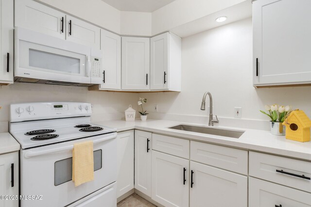1600 N Wilmot Rd Unit 155, Tucson, AZ 85712 - kitchen featuring white appliances, a sink, white cabinets, light countertops, and recessed lighting