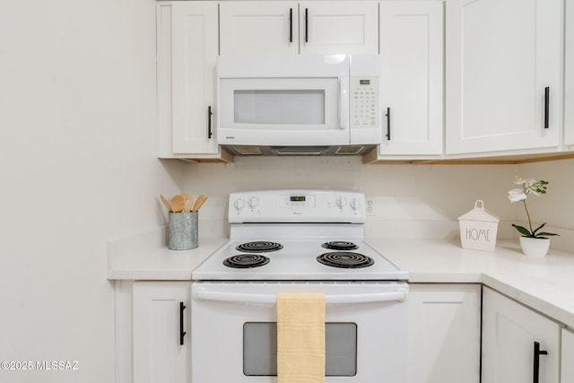 1600 N Wilmot Rd Unit 155, Tucson, AZ 85712 - kitchen with white appliances, white cabinetry, and light countertops