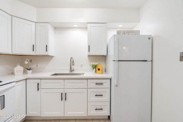 1600 N Wilmot Rd Unit 155, Tucson, AZ 85712 - kitchen with white appliances, a sink, white cabinetry, light countertops, and recessed lighting