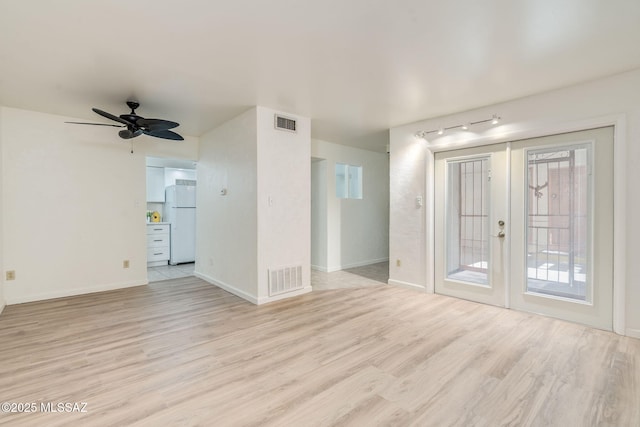 1600 N Wilmot Rd Unit 155, Tucson, AZ 85712 - spare room featuring light wood-style flooring, rail lighting, a ceiling fan, and baseboards