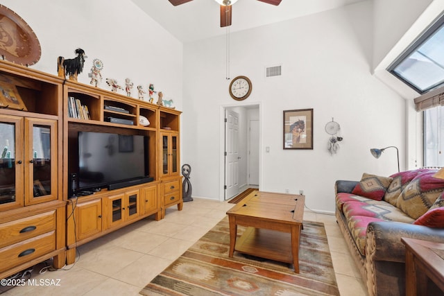 7133 E Grey Fox Ln, Tucson, AZ 85750 - living room featuring light tile patterned floors, a ceiling fan, and high vaulted ceiling