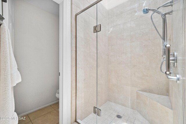 7133 E Grey Fox Ln, Tucson, AZ 85750 - bathroom with a shower stall, toilet, and tile patterned flooring
