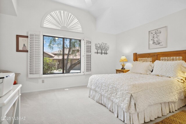 7133 E Grey Fox Ln, Tucson, AZ 85750 - carpeted bedroom with baseboards and lofted ceiling