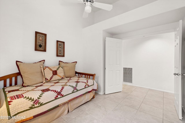 7133 E Grey Fox Ln, Tucson, AZ 85750 - bedroom with a towering ceiling, a ceiling fan, baseboards, and light tile patterned floors