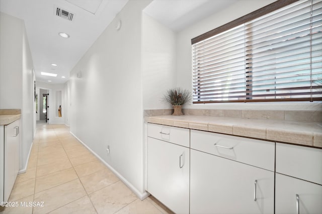 7133 E Grey Fox Ln, Tucson, AZ 85750 - hall with light tile patterned flooring, recessed lighting, and baseboards