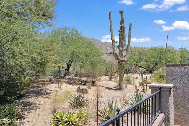 7133 E Grey Fox Ln, Tucson, AZ 85750 - view of yard with a balcony and a mountain view