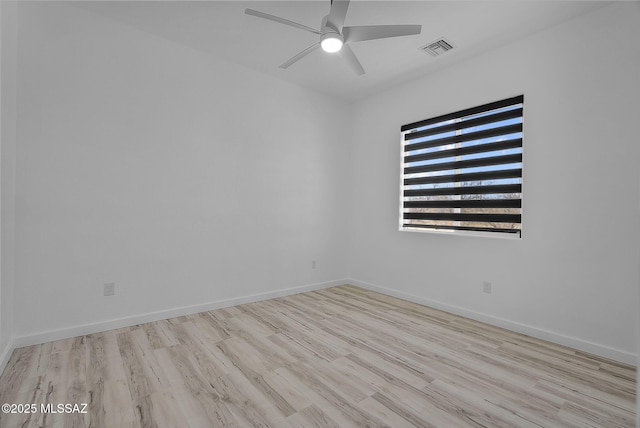 1803 Japon Ct, Rio Rico, AZ 85648 - spare room featuring ceiling fan, wood finished floors, and baseboards