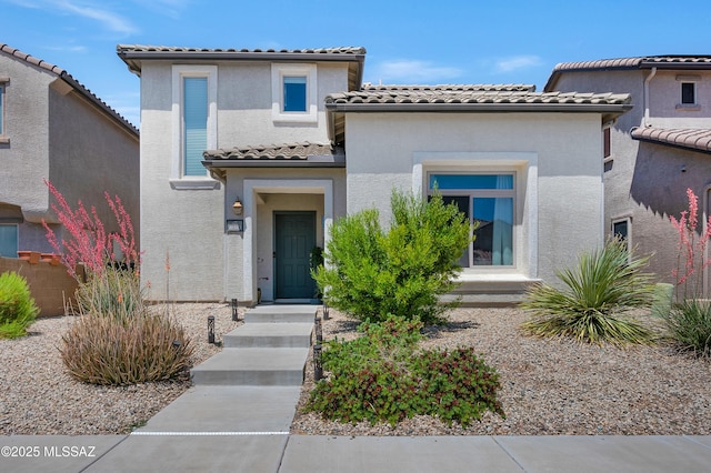10583 E Forest Falls Ct, Tucson, AZ 85747 - mediterranean / spanish-style home featuring a tiled roof and stucco siding