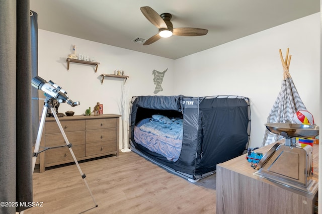 10583 E Forest Falls Ct, Tucson, AZ 85747 - bedroom featuring light wood-style floors and a ceiling fan