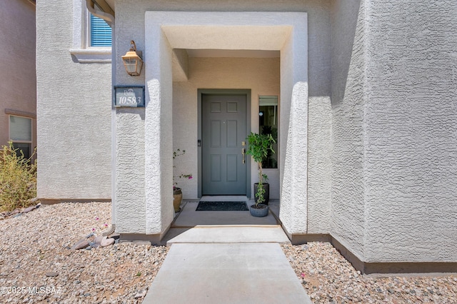 10583 E Forest Falls Ct, Tucson, AZ 85747 - view of exterior entry with stucco siding