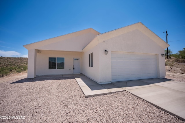 1681 Trampa Ct, Rio Rico, AZ 85648 - single story home featuring an attached garage, driveway, and stucco siding