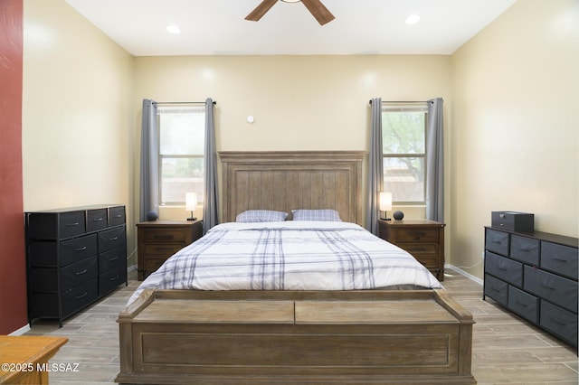 2511 N Avenida Tabica, Green Valley, AZ 85614 - bedroom featuring light wood-style flooring, baseboards, a ceiling fan, and recessed lighting