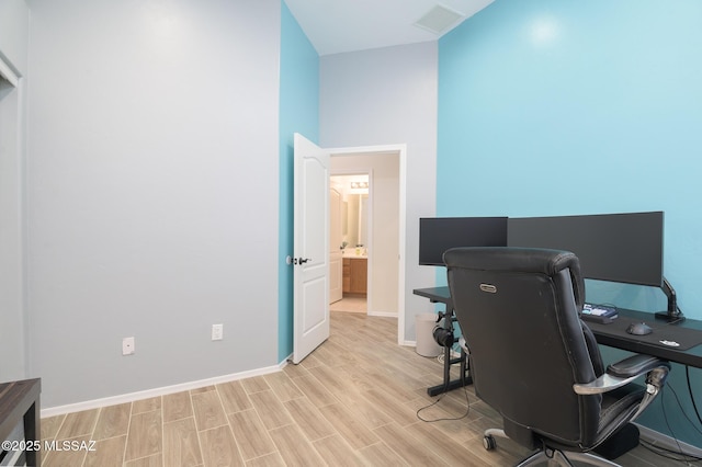 2511 N Avenida Tabica, Green Valley, AZ 85614 - home office featuring light wood-type flooring and baseboards