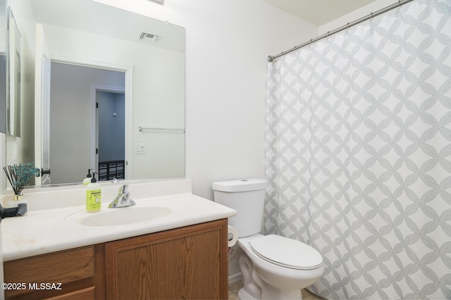 2511 N Avenida Tabica, Green Valley, AZ 85614 - bathroom with vanity, toilet, and a shower with curtain