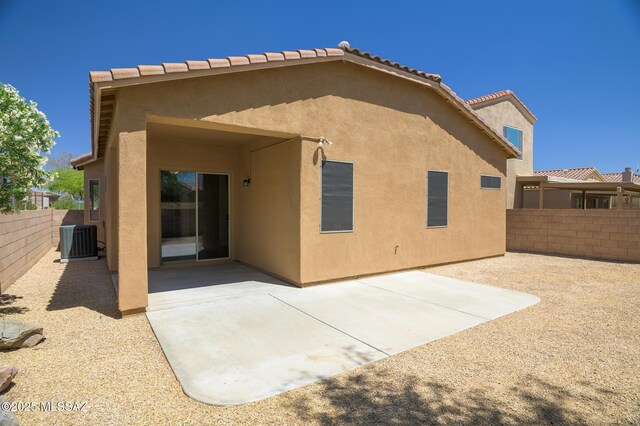 2511 N Avenida Tabica, Green Valley, AZ 85614 - back of house with stucco siding, central air condition unit, a patio, and a tiled roof
