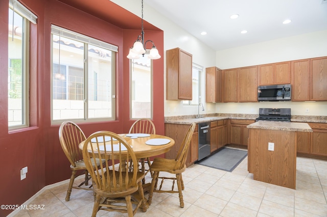 2511 N Avenida Tabica, Green Valley, AZ 85614 - kitchen featuring appliances with stainless steel finishes, a kitchen island, a sink, a chandelier, and light countertops