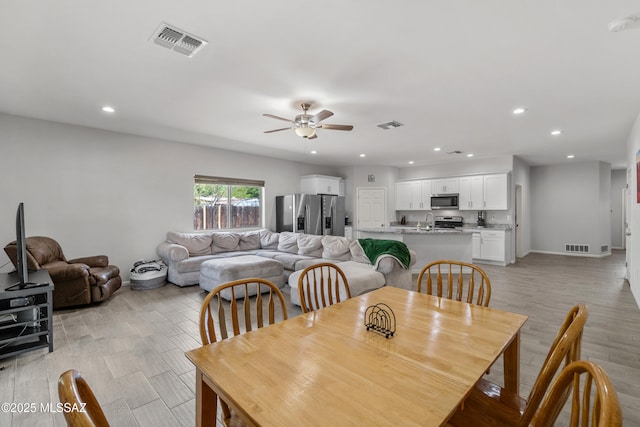 1941 E Greenlee Rd, Tucson, AZ 85719 - dining space with ceiling fan, recessed lighting, light wood-type flooring, and baseboards