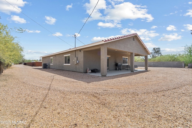 1941 E Greenlee Rd, Tucson, AZ 85719 - rear view of property with a patio, stucco siding, and a tiled roof