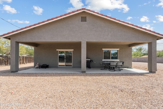 1941 E Greenlee Rd, Tucson, AZ 85719 - back of property with a patio area, stucco siding, and a tile roof