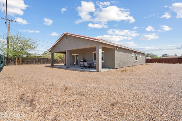1941 E Greenlee Rd, Tucson, AZ 85719 - back of house with stucco siding, a fenced backyard, and a patio area