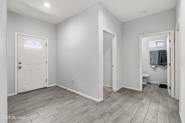 1941 E Greenlee Rd, Tucson, AZ 85719 - entryway with wood tiled floors, baseboards, and healthy amount of natural light