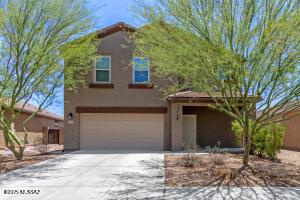 10342 N Crooked Peak Trl, Marana, AZ 85653 - view of front of home featuring a garage, stucco siding, and driveway