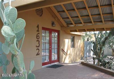 1632 N Columbus Blvd, Tucson, AZ 85712 - property entrance with french doors and stucco siding