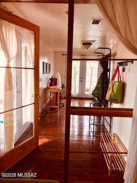1632 N Columbus Blvd, Tucson, AZ 85712 - hallway featuring french doors and hardwood / wood-style flooring