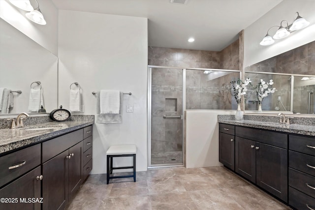 1759 E Via Colomba Bianca, Tucson, AZ 85737 - bathroom featuring a shower stall and two vanities