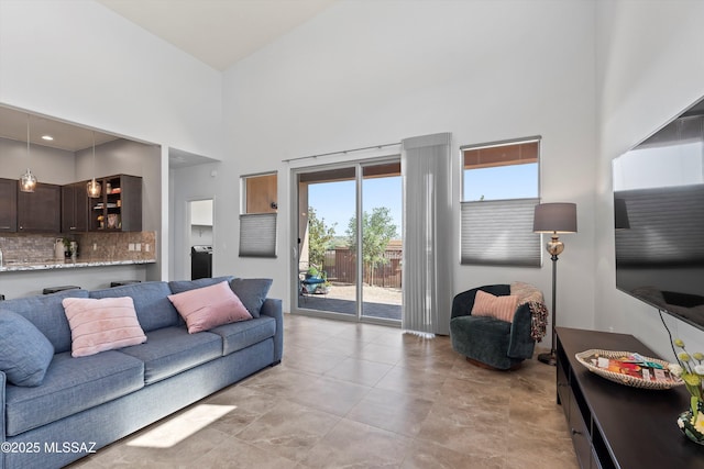 1759 E Via Colomba Bianca, Tucson, AZ 85737 - living room featuring a towering ceiling and healthy amount of natural light