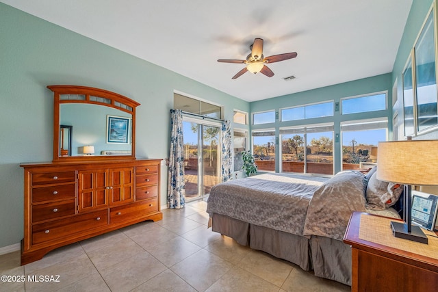 1861 E Crown Ridge Way, Oro Valley, AZ 85755 - tiled bedroom with access to outside, a ceiling fan, and baseboards