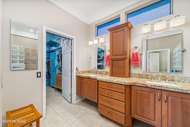 1861 E Crown Ridge Way, Oro Valley, AZ 85755 - bathroom featuring double vanity, a spacious closet, and tile patterned flooring