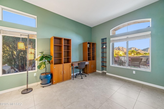 1861 E Crown Ridge Way, Oro Valley, AZ 85755 - tiled home office with baseboards, a high ceiling, and a mountain view