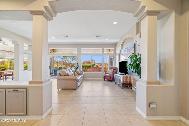 1861 E Crown Ridge Way, Oro Valley, AZ 85755 - living area featuring baseboards, light tile patterned floors, decorative columns, and recessed lighting