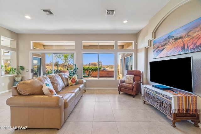 1861 E Crown Ridge Way, Oro Valley, AZ 85755 - living room with recessed lighting, light tile patterned floors, and baseboards