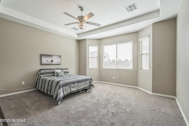 3022 S Open Range Way, Tucson, AZ 85713 - carpeted bedroom with a tray ceiling, baseboards, and ceiling fan