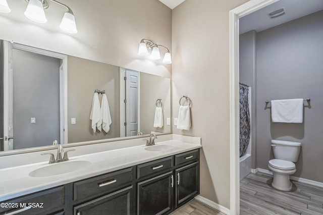 3022 S Open Range Way, Tucson, AZ 85713 - full bath featuring wood finished floors, toilet, double vanity, baseboards, and shower / bathtub combination with curtain