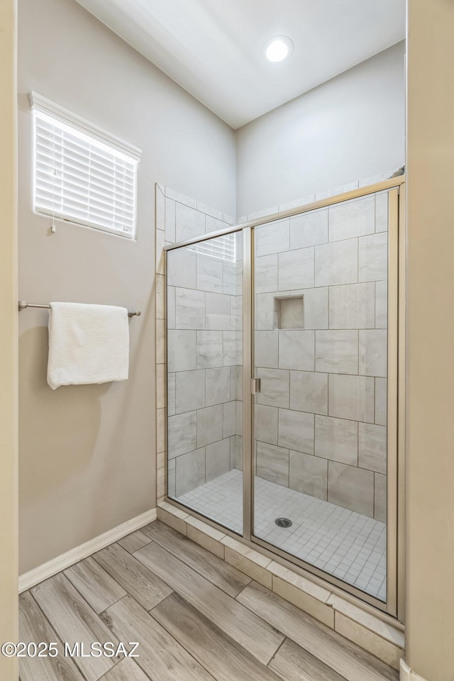 3022 S Open Range Way, Tucson, AZ 85713 - bathroom featuring a stall shower, wood tiled floors, baseboards, and recessed lighting