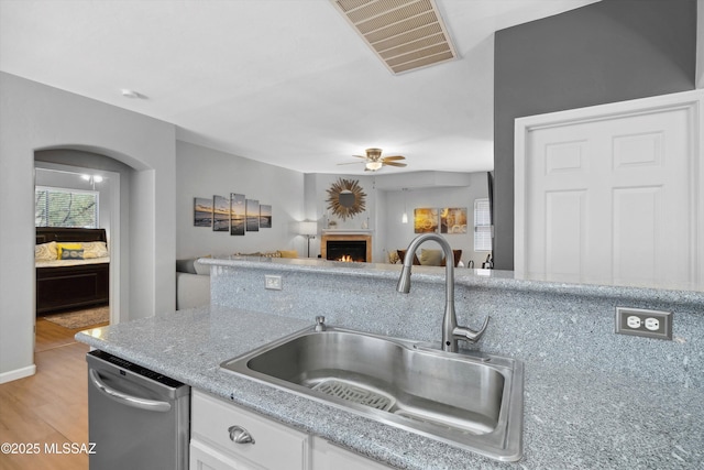 14511 S Camino Tierra Luna, Sahuarita, AZ 85629 - kitchen featuring a sink, dishwasher, a ceiling fan, open floor plan, and white cabinets