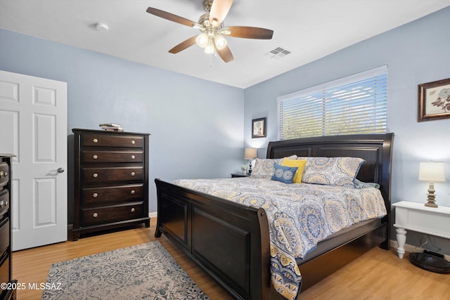 14511 S Camino Tierra Luna, Sahuarita, AZ 85629 - bedroom featuring light wood-style floors and ceiling fan