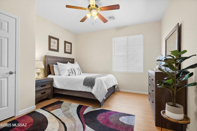 14511 S Camino Tierra Luna, Sahuarita, AZ 85629 - bedroom featuring light wood-style floors, baseboards, and ceiling fan