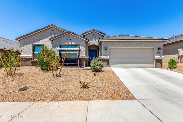 5568 W Summer Vw Dr, Marana, AZ 85658 - view of front of property with an attached garage, driveway, stucco siding, and a tiled roof