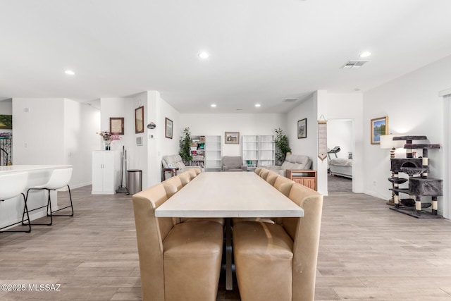 5568 W Summer Vw Dr, Marana, AZ 85658 - dining area with light wood-type flooring, recessed lighting, and baseboards
