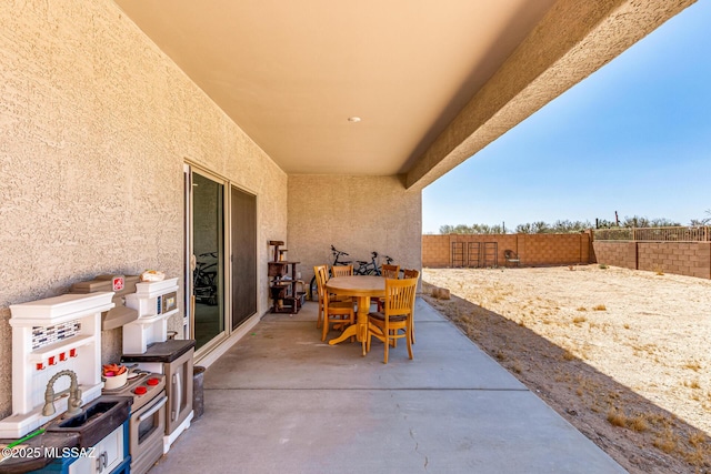 5568 W Summer Vw Dr, Marana, AZ 85658 - fenced backyard with a patio and outdoor dining area