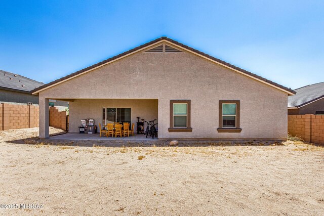 5568 W Summer Vw Dr, Marana, AZ 85658 - rear view of house featuring stucco siding, a fenced backyard, and a patio