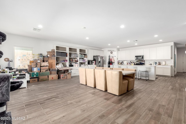 5568 W Summer Vw Dr, Marana, AZ 85658 - living area featuring light wood-style flooring and recessed lighting
