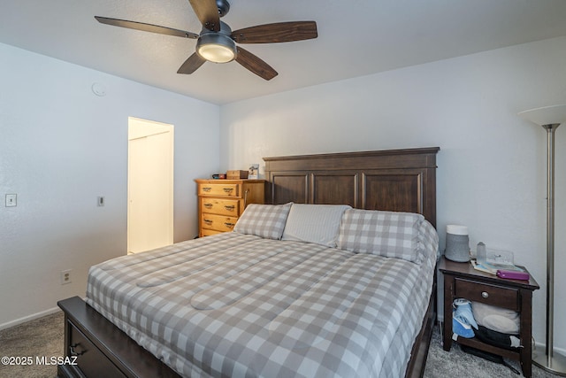 7913 E Colette Cir Unit 44, Tucson, AZ 85710 - bedroom with dark carpet, baseboards, and ceiling fan